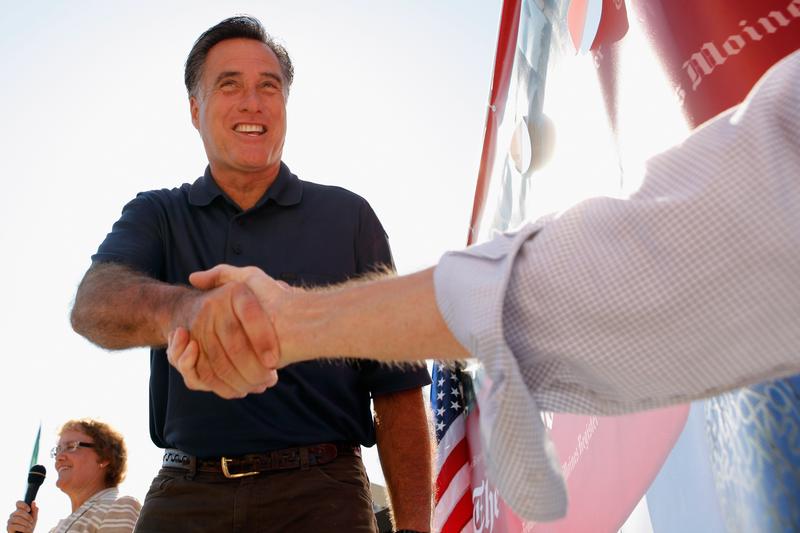 Republican presidential candidate Mitt Romney introduces himself to voters at the Iowa State Fair August 11, 2011 in Des Moines, Iowa.